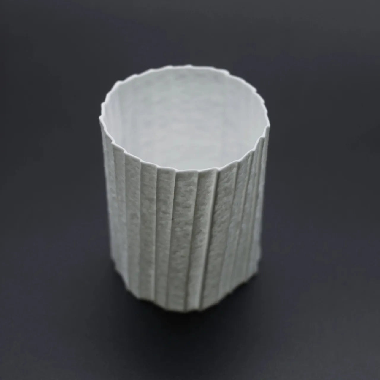 Kilnora Lumora Stonefold Series 200 ml porcelain cup featuring handcrafted rock-fold textures and soft translucence.