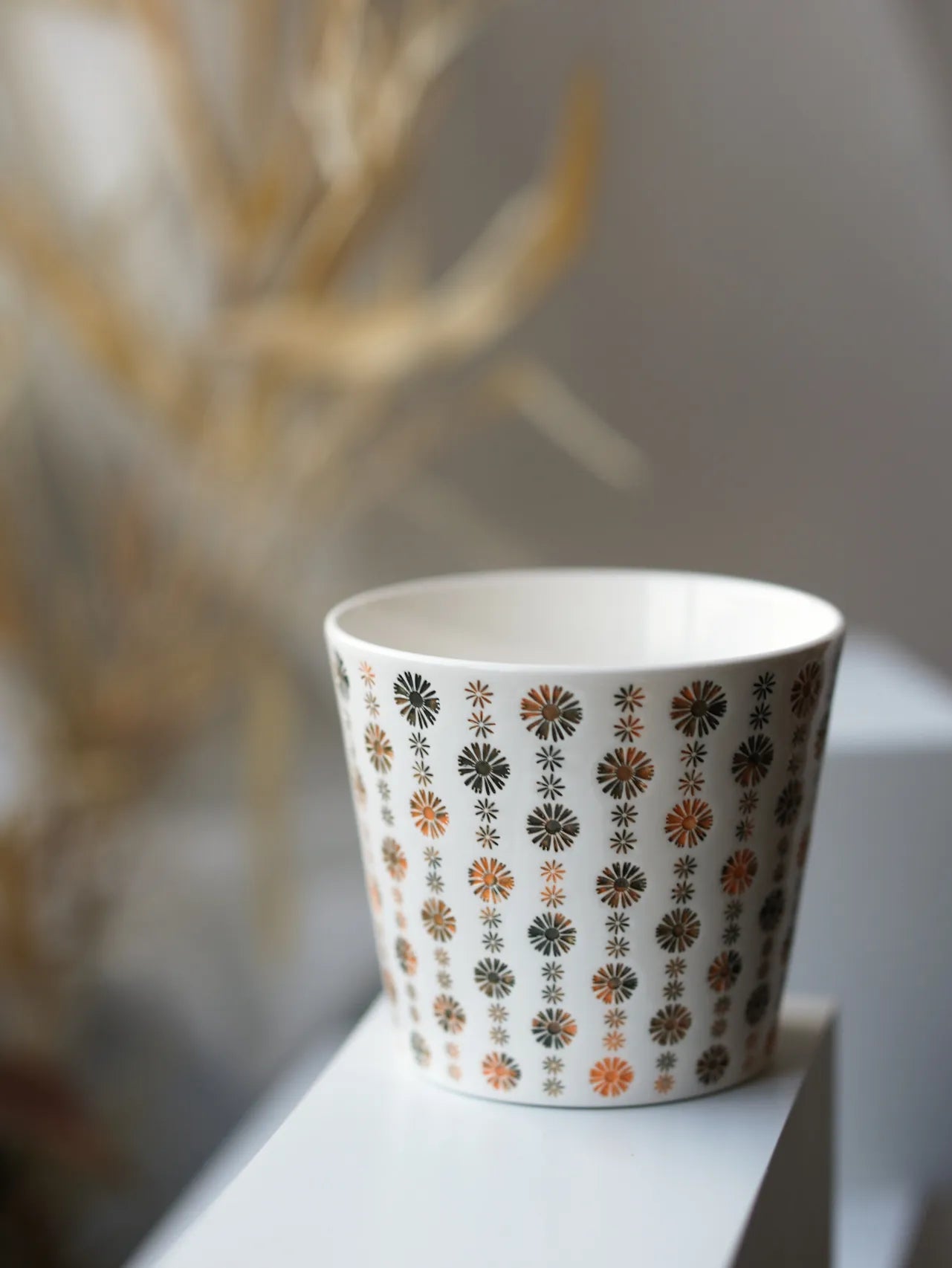 Kilnora LOOFA STUDIO Apricot Hue carved daisy porcelain cup with gentle apricot glaze