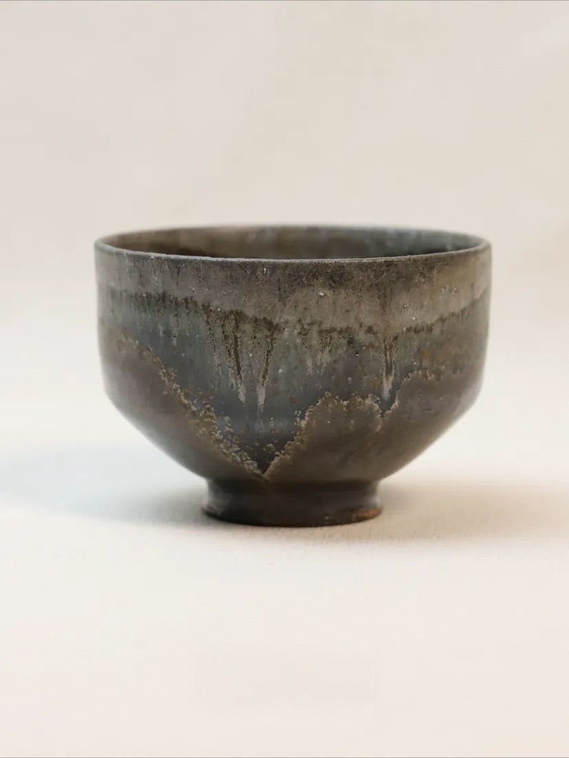 Kilnora Chihiro Series soda-fired cup with natural soda ash glaze variations on porcelain.