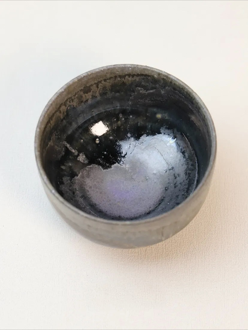 Kilnora Chihiro Series soda-fired cup with natural soda ash glaze variations on porcelain.