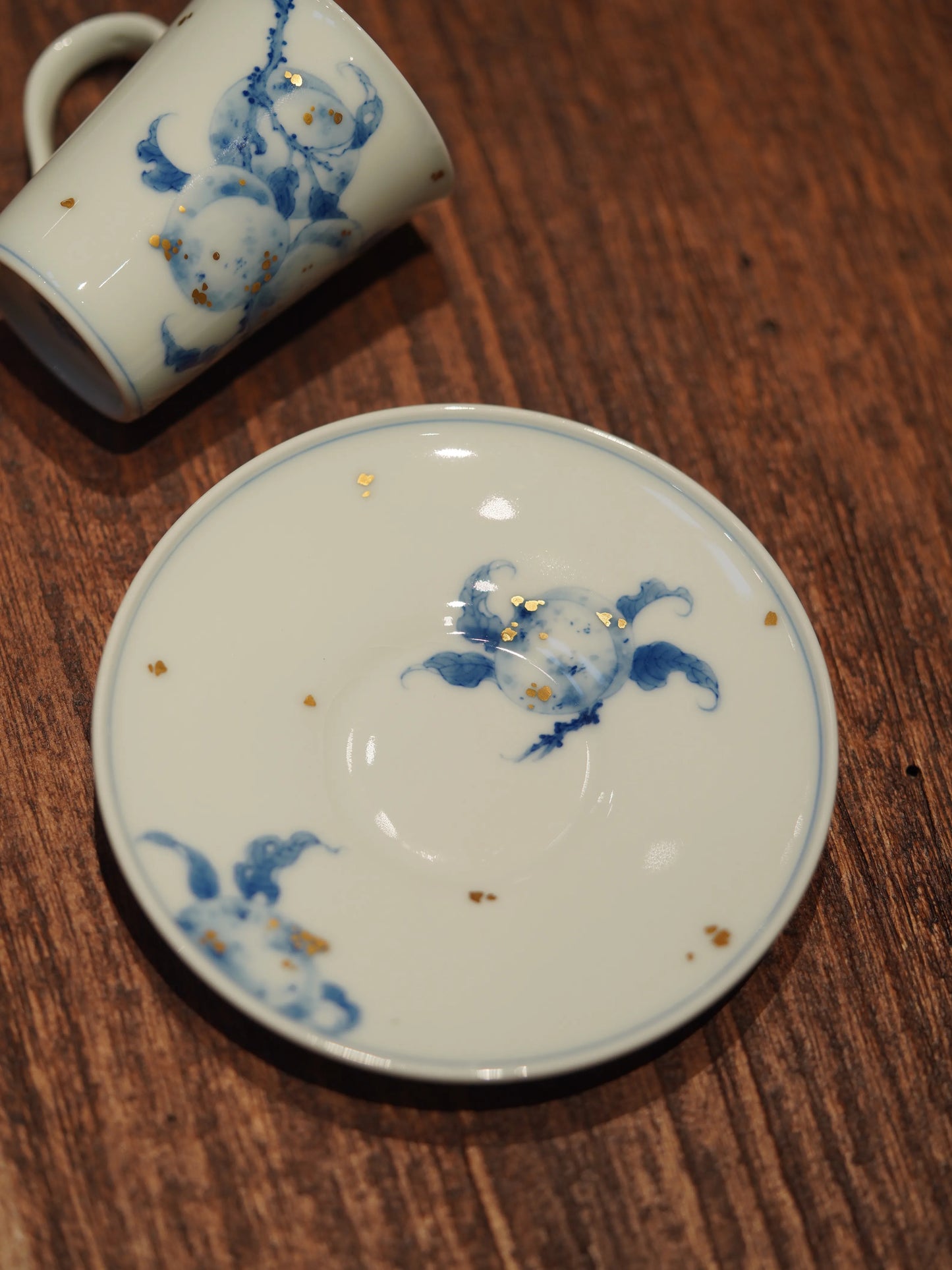 Kilnora Blue-and-White Gilded Five Immortals porcelain cup and saucer set with gold-accented immortal figures