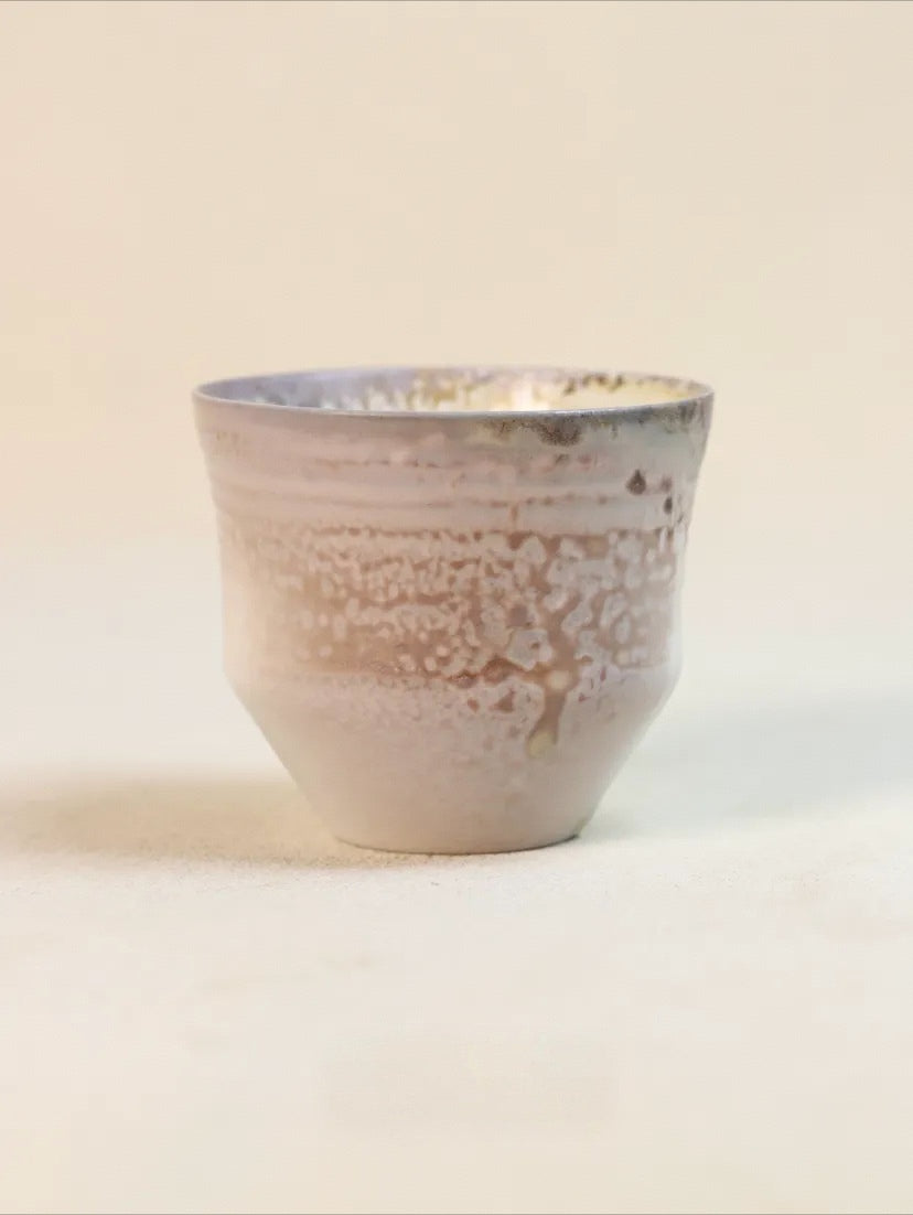 Kilnora Chihiro Series wood-fired porcelain cup with gentle curves and flame-kissed finish.