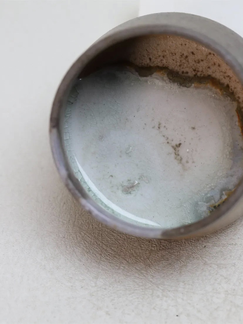 Kilnora Chihiro Series charcoal bare cup wood-fired for deep graphite tones and raw texture.