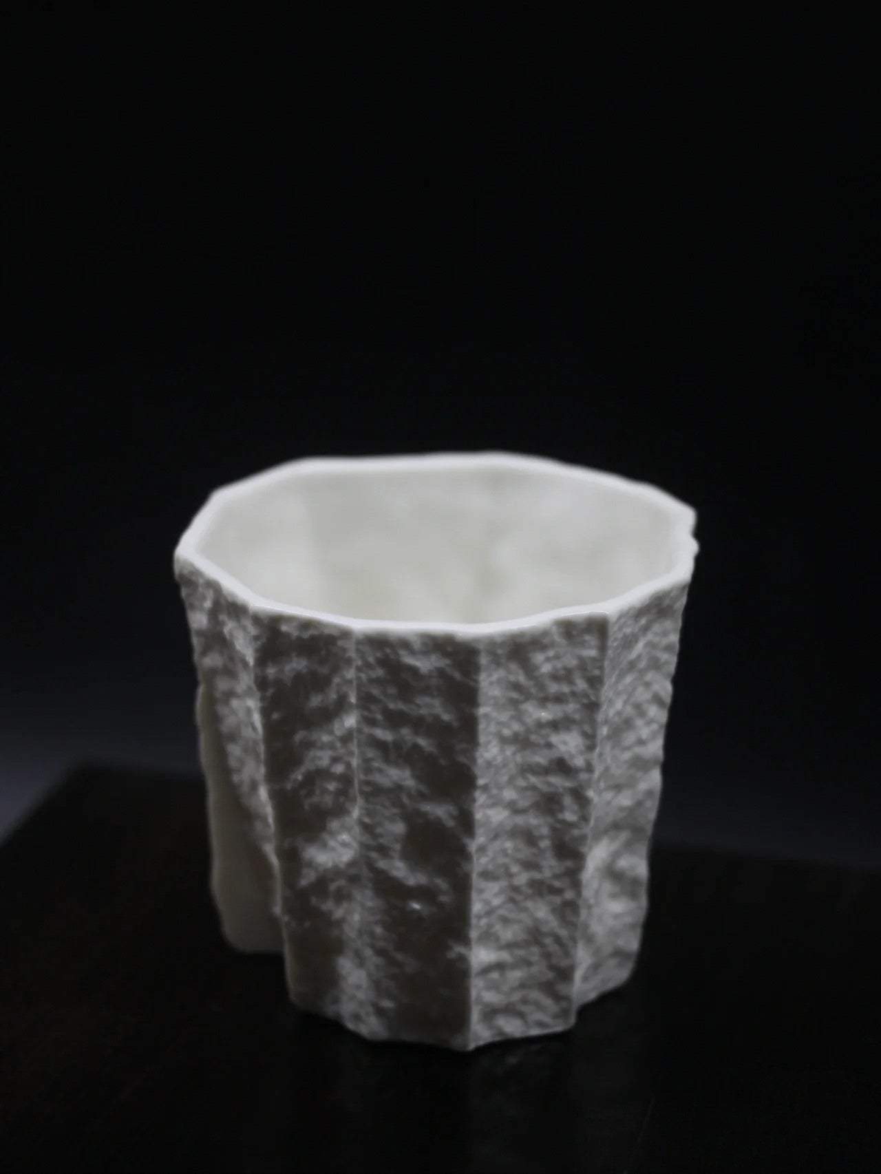 Kilnora Lumora Sekisen Series 180 ml porcelain cup with folded stone-inspired form and translucent paper-thin walls.