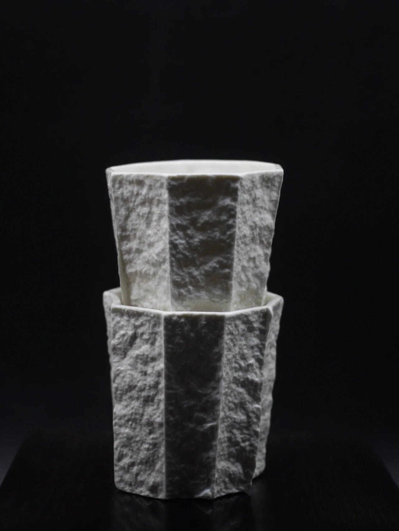 Kilnora Lumora Sekisen Series 250 ml porcelain cup with folded stone-inspired form and translucent paper-thin walls.