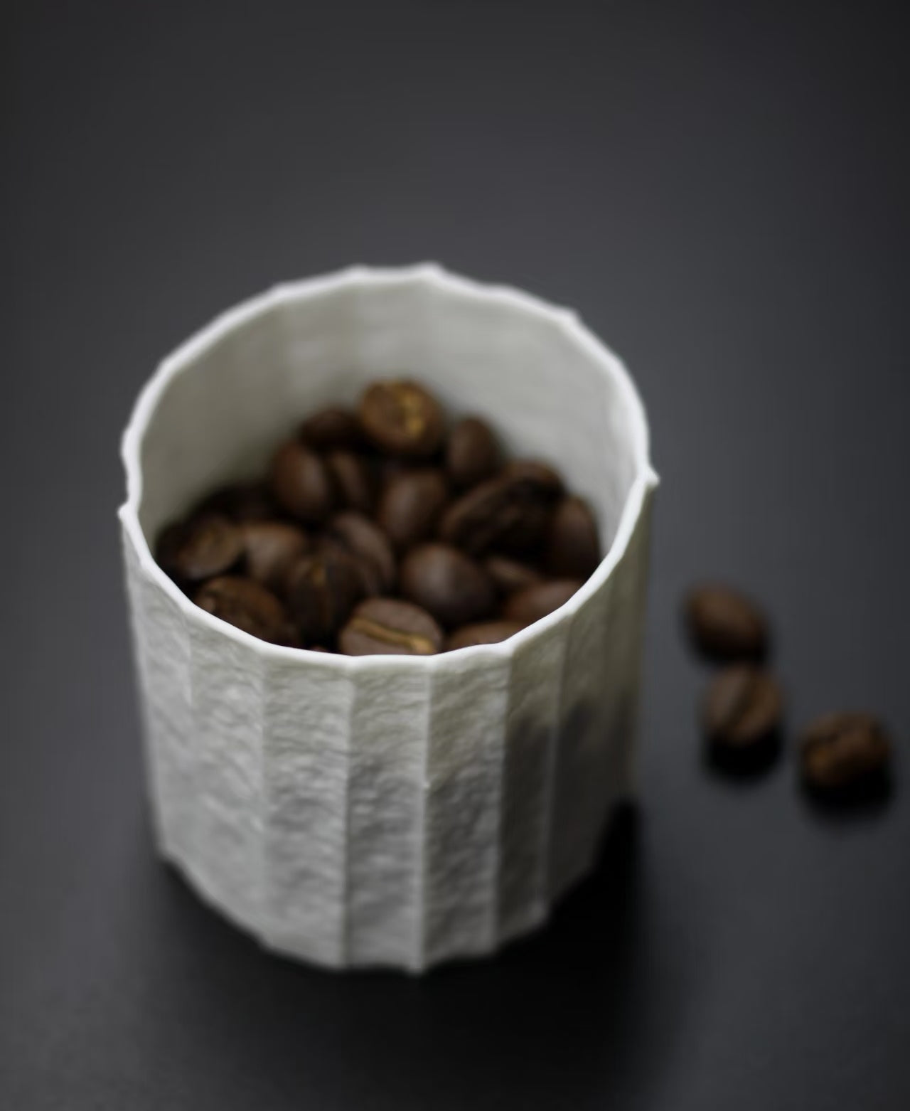 Kilnora Lumora Stonefold Series 180 ml porcelain cup featuring handcrafted rock-fold textures and soft translucence.