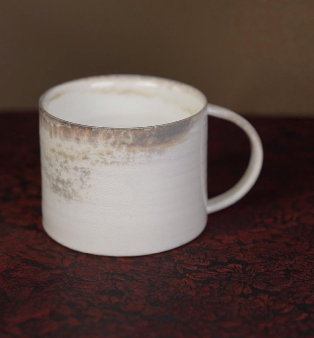 Kilnora Dai-in Series high-white clay wood-fired mug showcasing pure porcelain translucence.