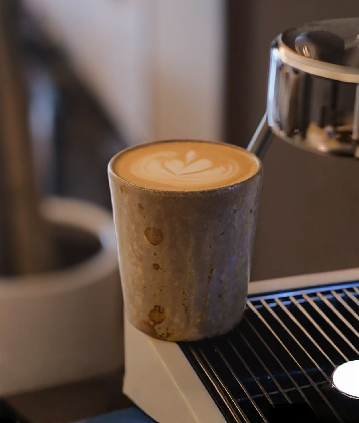 Kilnora Kyūshō Series white slip porcelain cup with straight sides and flame-textured rim.