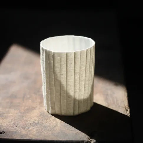 Kilnora Lumora Stonefold Series 200 ml porcelain cup featuring handcrafted rock-fold textures and soft translucence.