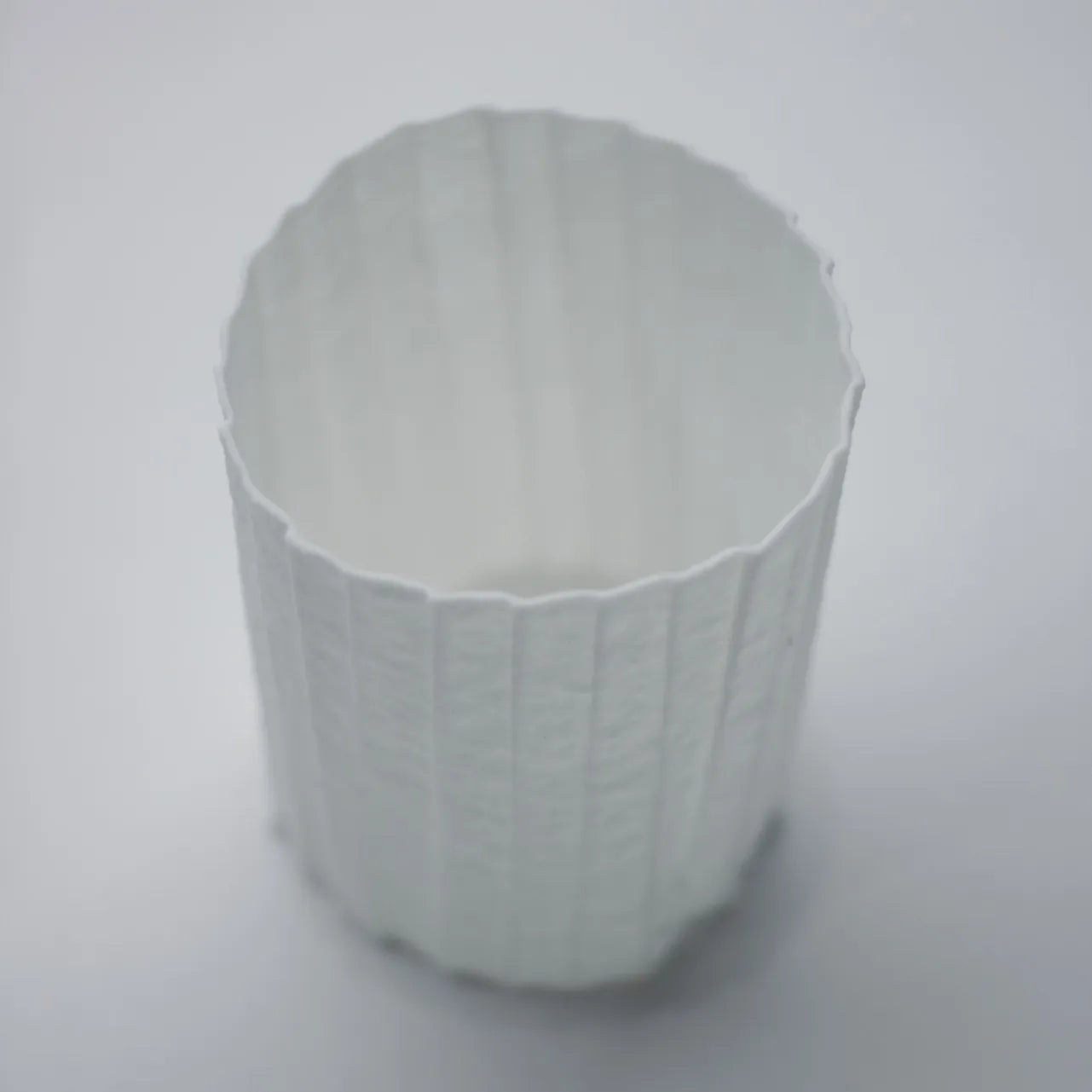 Kilnora Lumora Stonefold Series 200 ml porcelain cup featuring handcrafted rock-fold textures and soft translucence.