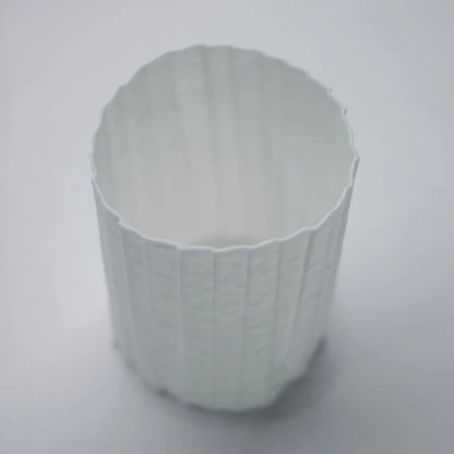 Kilnora Lumora Stonefold Series 200 ml porcelain cup featuring handcrafted rock-fold textures and soft translucence.