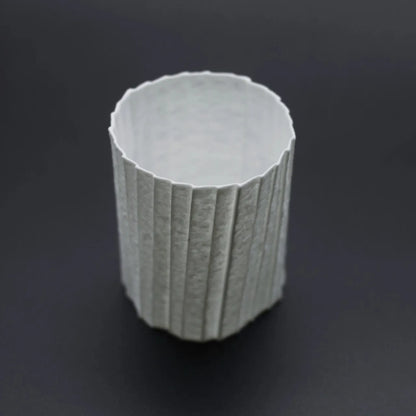 Kilnora Lumora Stonefold Series 200 ml porcelain cup featuring handcrafted rock-fold textures and soft translucence.