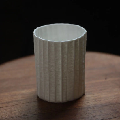 Kilnora Lumora Stonefold Series 200 ml porcelain cup featuring handcrafted rock-fold textures and soft translucence.