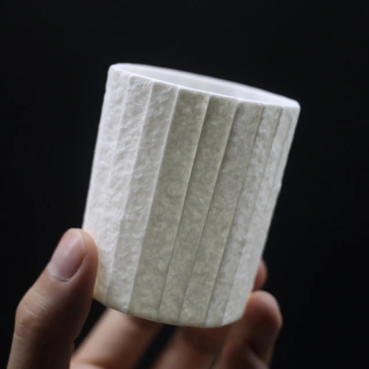 Kilnora Lumora Stonefold Series 180 ml porcelain cup featuring handcrafted rock-fold textures and soft translucence.