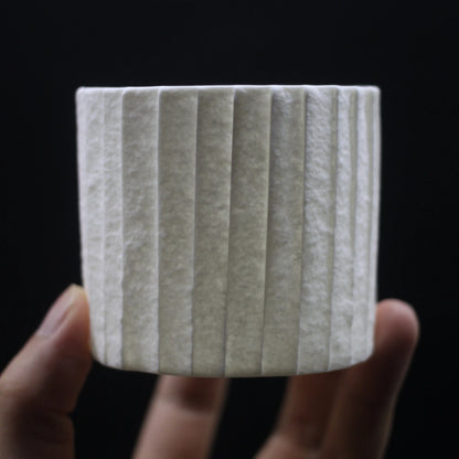 Kilnora Lumora Stonefold Series 250 ml porcelain cup with natural stone-folded facets and delicate light-capturing translucence.