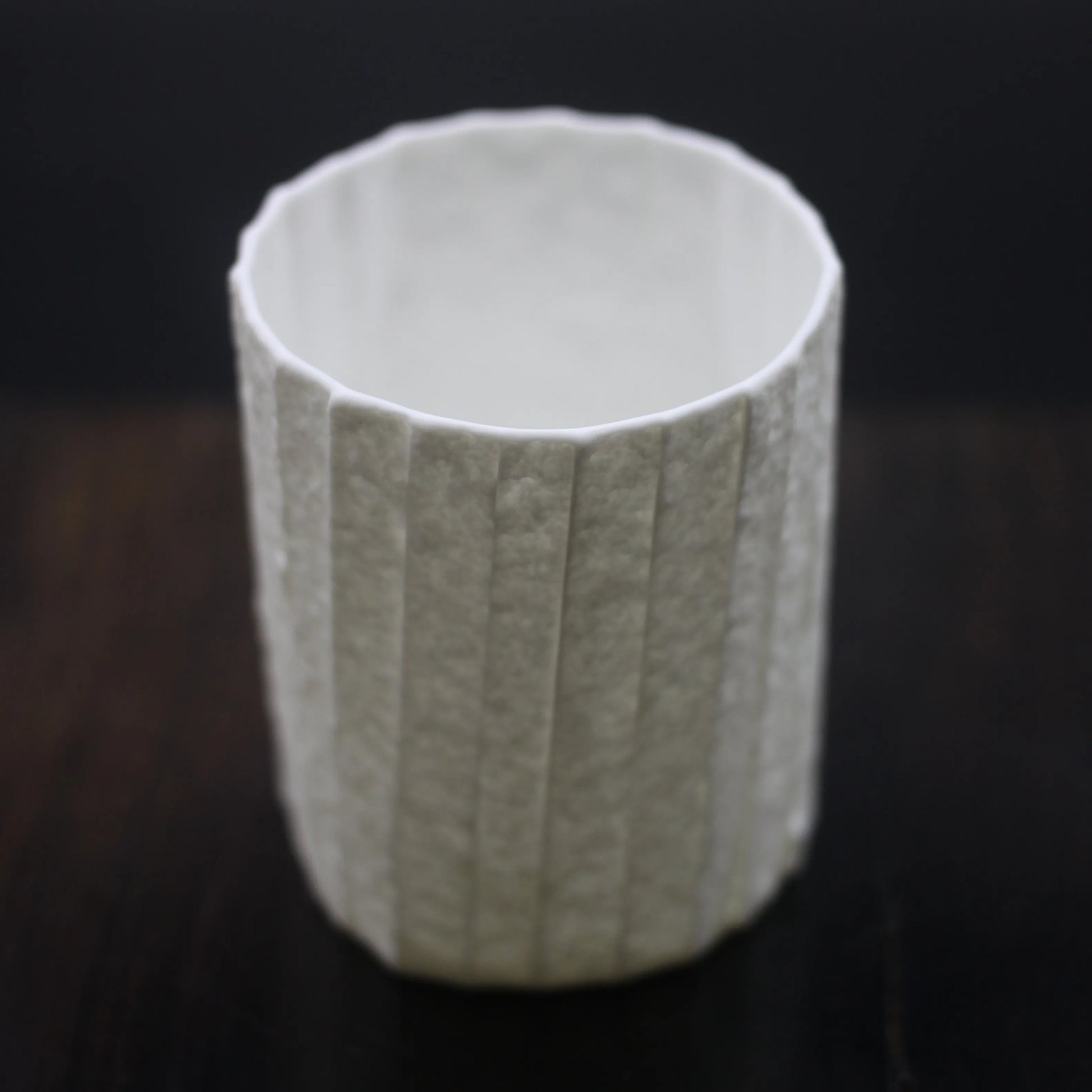 Kilnora Lumora Stonefold Series 180 ml porcelain cup featuring handcrafted rock-fold textures and soft translucence.