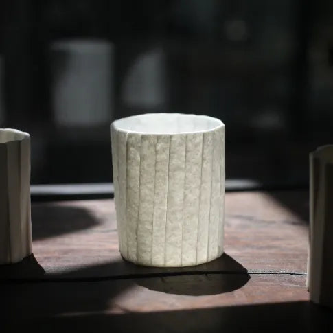 Kilnora Lumora Stonefold Series 180 ml porcelain cup featuring handcrafted rock-fold textures and soft translucence.