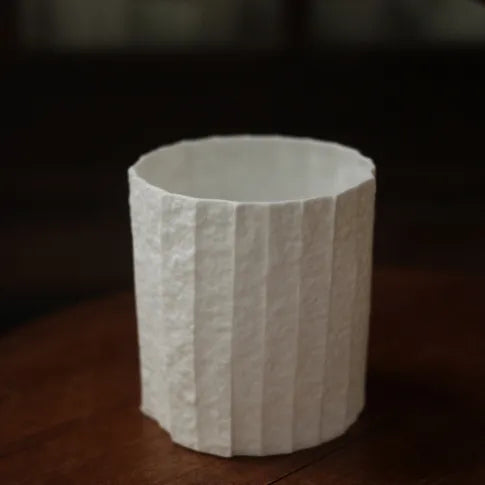 Kilnora Lumora Stonefold Series 220 ml porcelain cup featuring handcrafted rock-fold textures and soft translucence.
