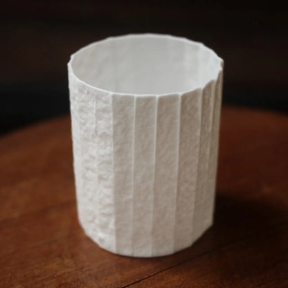 Kilnora Lumora Stonefold Series 180 ml porcelain cup featuring handcrafted rock-fold textures and soft translucence.