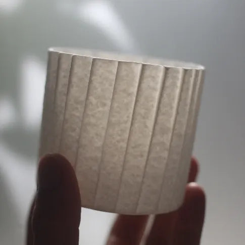 Kilnora Lumora Stonefold Series 250 ml porcelain cup with natural stone-folded facets and delicate light-capturing translucence.