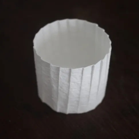 Kilnora Lumora Stonefold Series 250 ml porcelain cup with natural stone-folded facets and delicate light-capturing translucence.