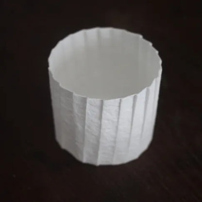 Kilnora Lumora Stonefold Series 250 ml porcelain cup with natural stone-folded facets and delicate light-capturing translucence.