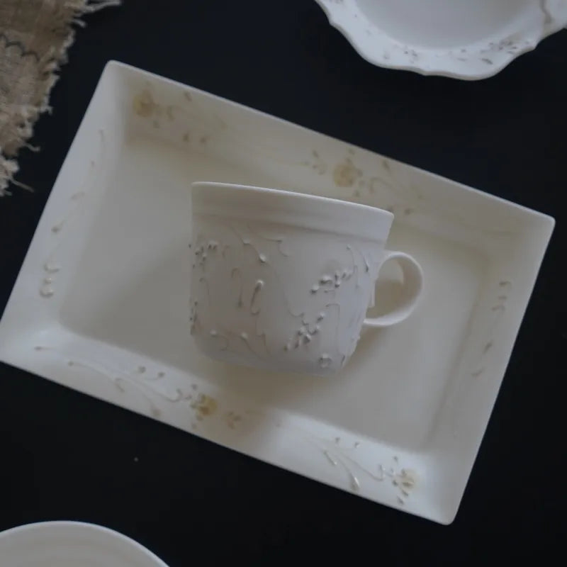Kilnora Sōng Dandelion Series matte white handled coffee cup featuring custom slip decoration and soft matte finish