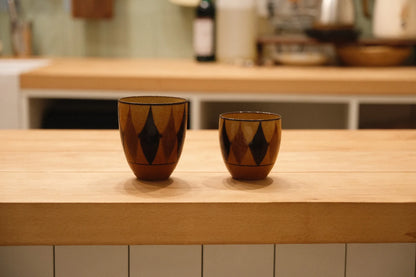 Kilnora Shisō diamond-shaped porcelain cup with geometric underglaze motifs