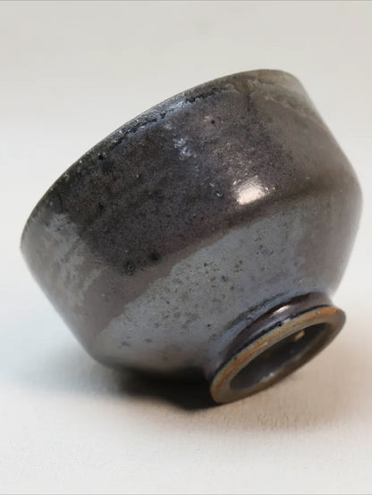 Kilnora Chihiro Series soda-fired cup with natural soda ash glaze variations on porcelain.