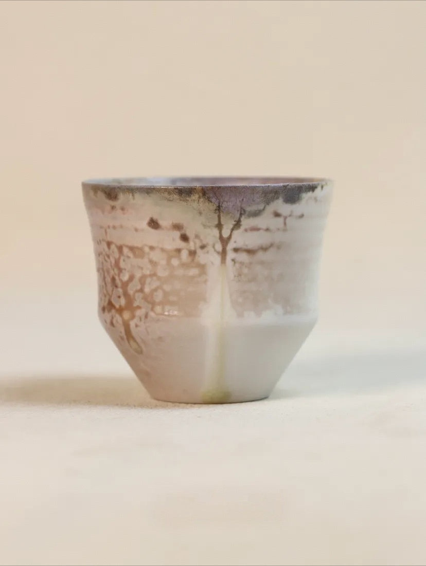 Kilnora Chihiro Series wood-fired porcelain cup with gentle curves and flame-kissed finish.