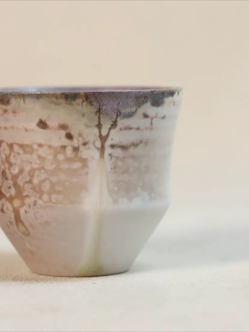 Kilnora Chihiro Series wood-fired porcelain cup with gentle curves and flame-kissed finish.