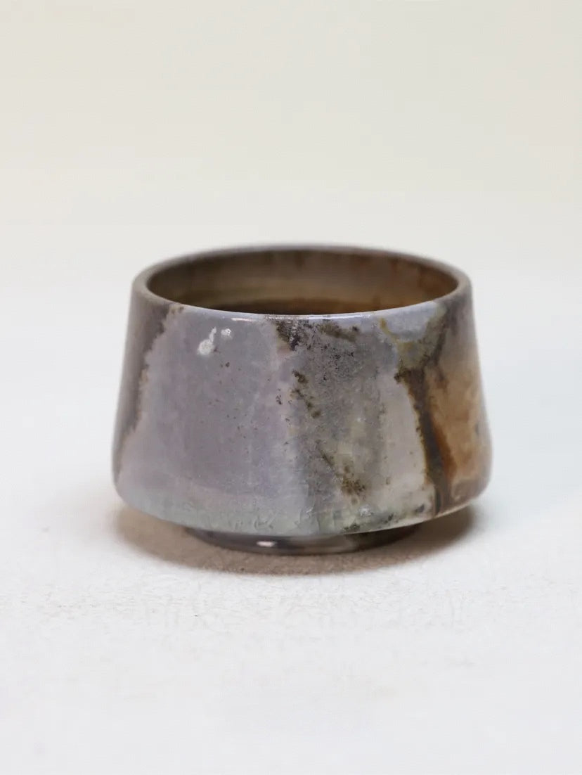 Kilnora Chihiro Series charcoal bare cup wood-fired for deep graphite tones and raw texture.