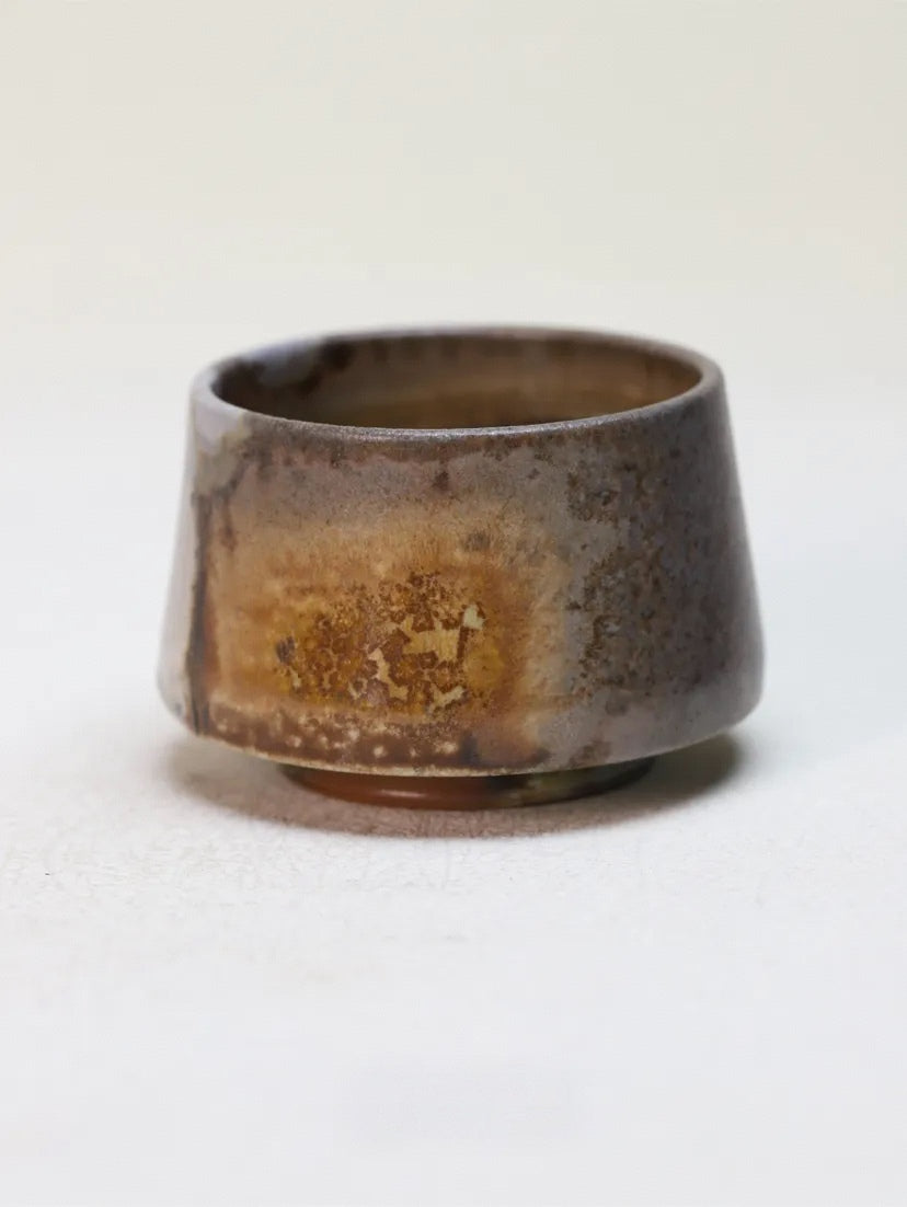 Kilnora Chihiro Series charcoal bare cup wood-fired for deep graphite tones and raw texture.
