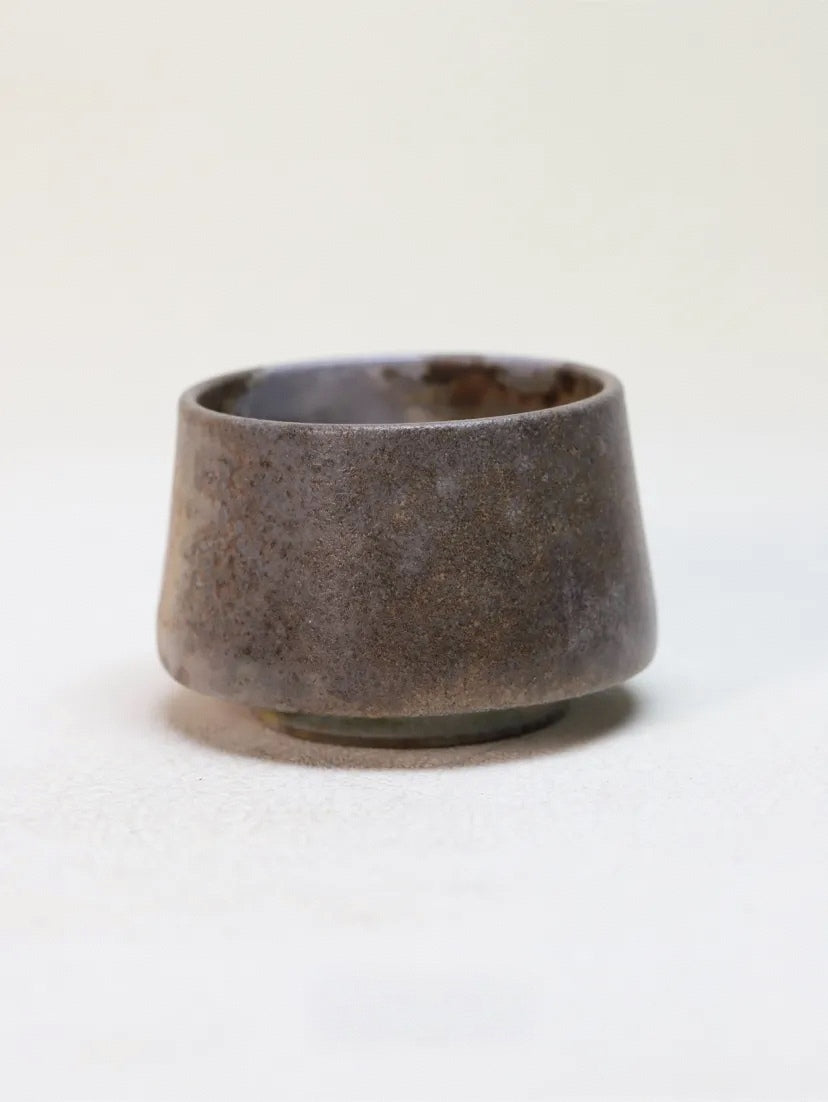 Kilnora Chihiro Series charcoal bare cup wood-fired for deep graphite tones and raw texture.