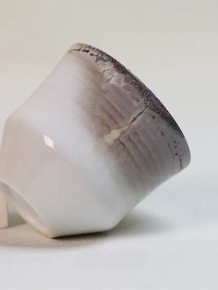 Kilnora Chihiro Series wood-fired porcelain cup with gentle curves and flame-kissed finish.