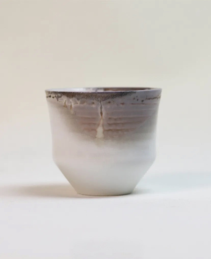 Kilnora Chihiro Series wood-fired porcelain cup with gentle curves and flame-kissed finish.