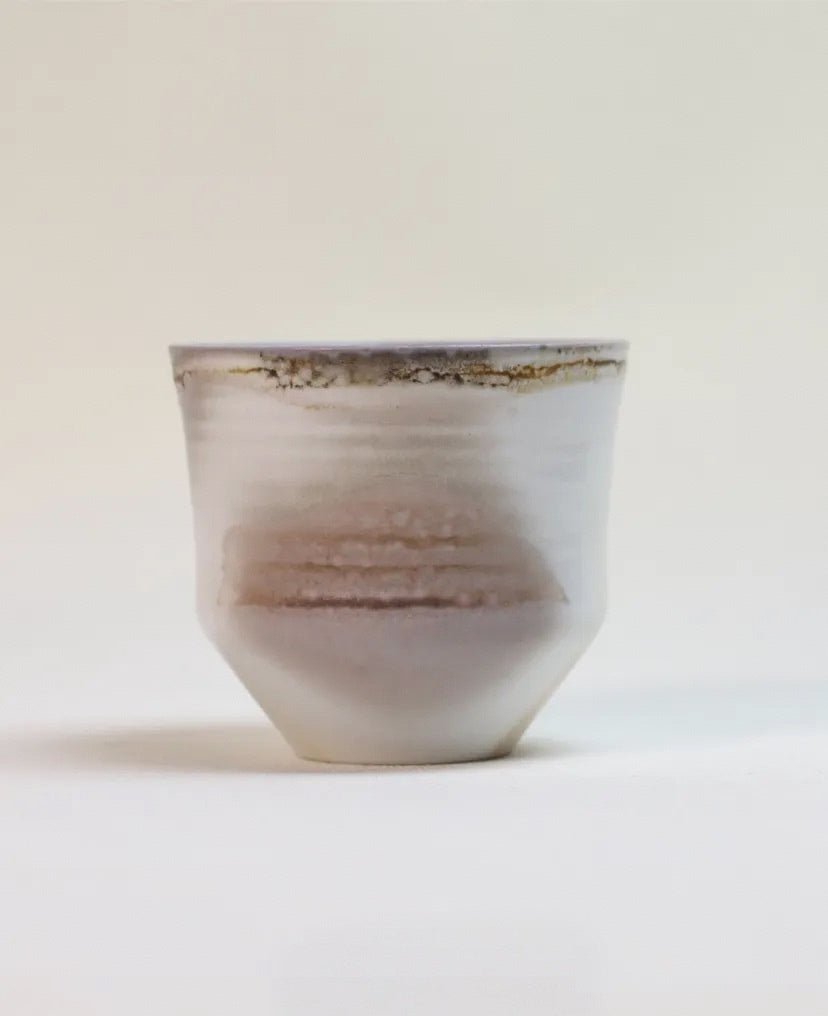 Kilnora Chihiro Series wood-fired porcelain cup with gentle curves and flame-kissed finish.