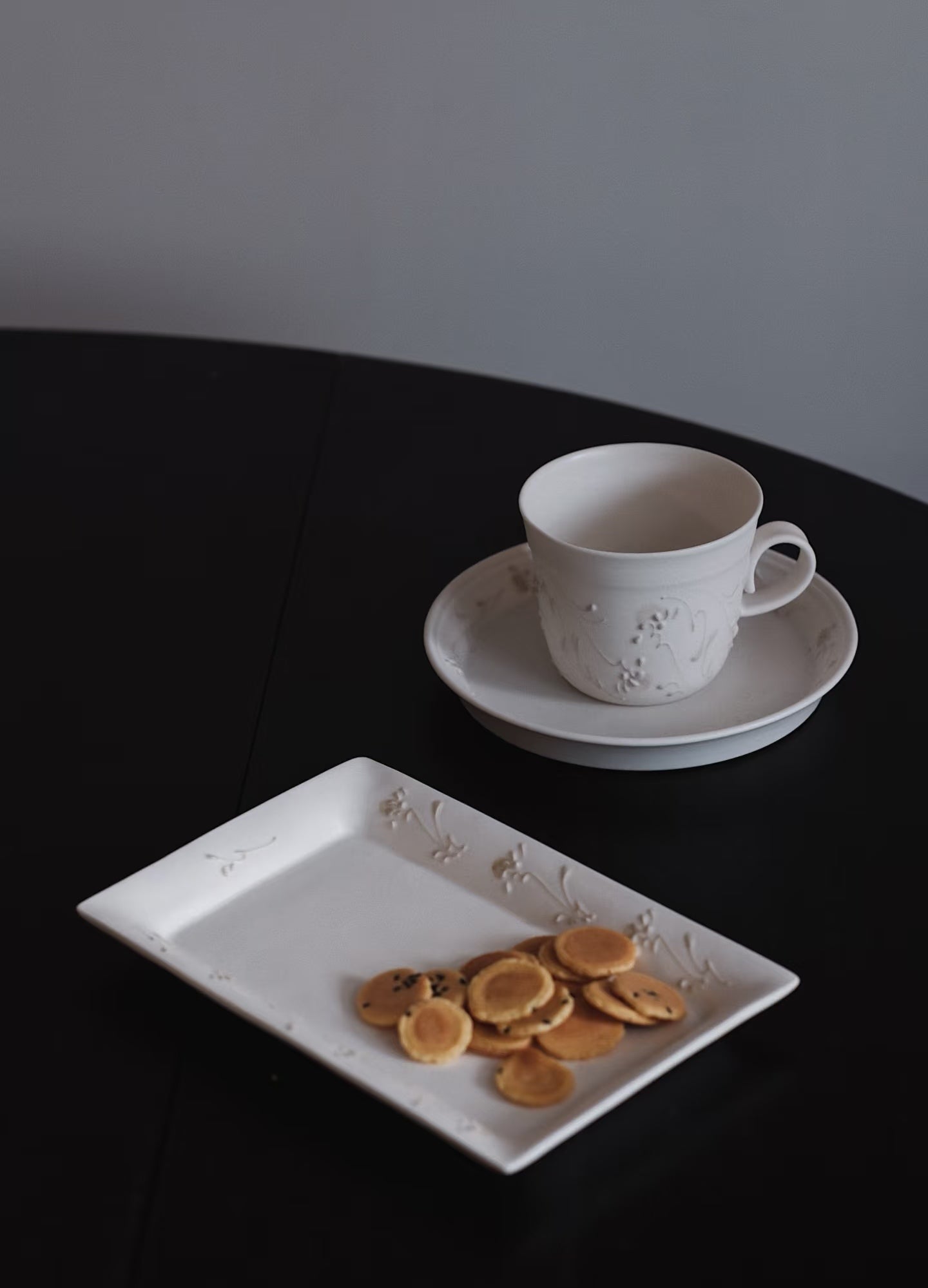 Kilnora Sōng Dandelion Series matte white handled coffee cup featuring custom slip decoration and soft matte finish