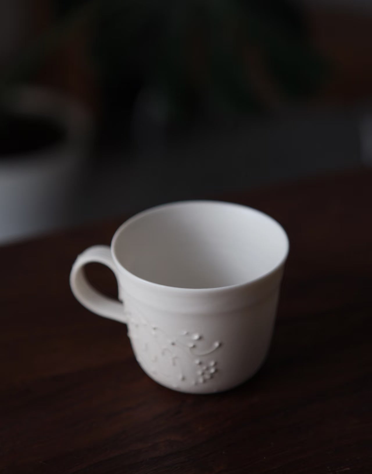 Kilnora Sōng Dandelion Series matte white handled coffee cup featuring custom slip decoration and soft matte finish