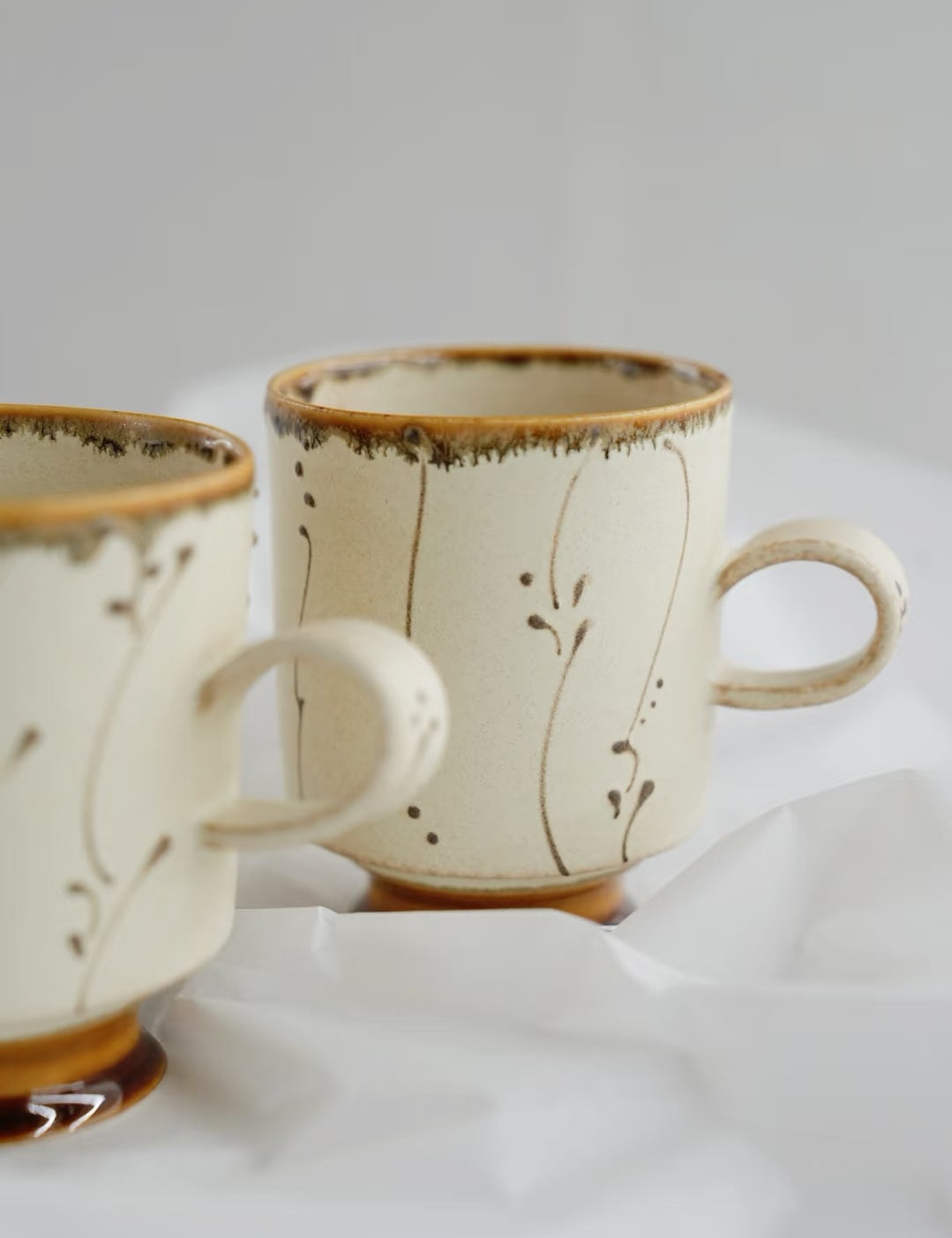 Kilnora Sōng Amber Series coffee cup featuring rich amber glaze and delicate relief patterns