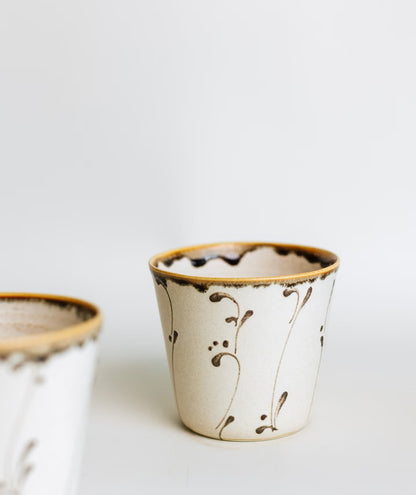 Kilnora Sōng Amber Series ceramic Chyongku cup with warm amber glaze and hand-painted slip motifs