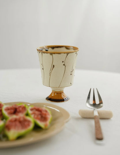 Kilnora Sōng Amber Series stemmed goblet with translucent amber glaze and elegant silhouette