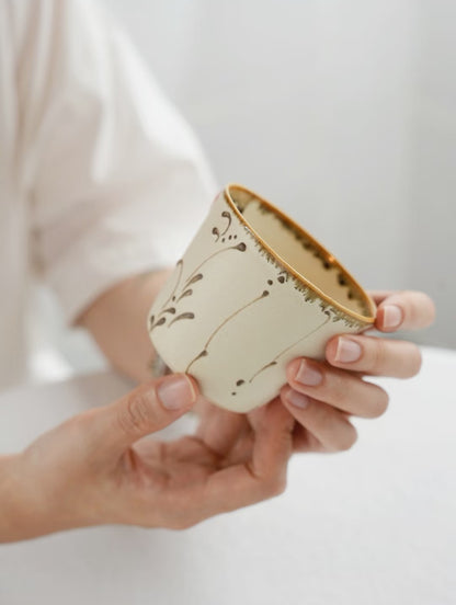 Kilnora Sōng Amber Series ceramic Chyongku cup with warm amber glaze and hand-painted slip motifs
