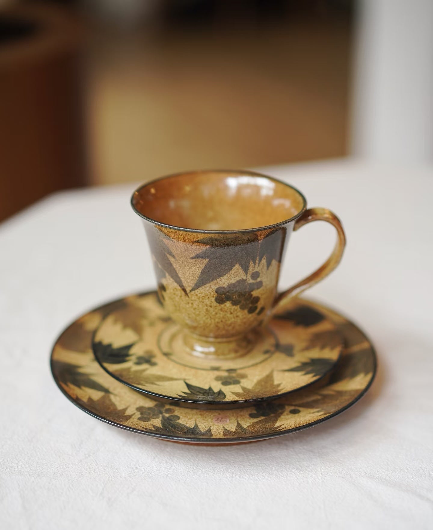 Kilnora Shisō cup and saucer set with blue-and-white grape Chyongku porcelain design