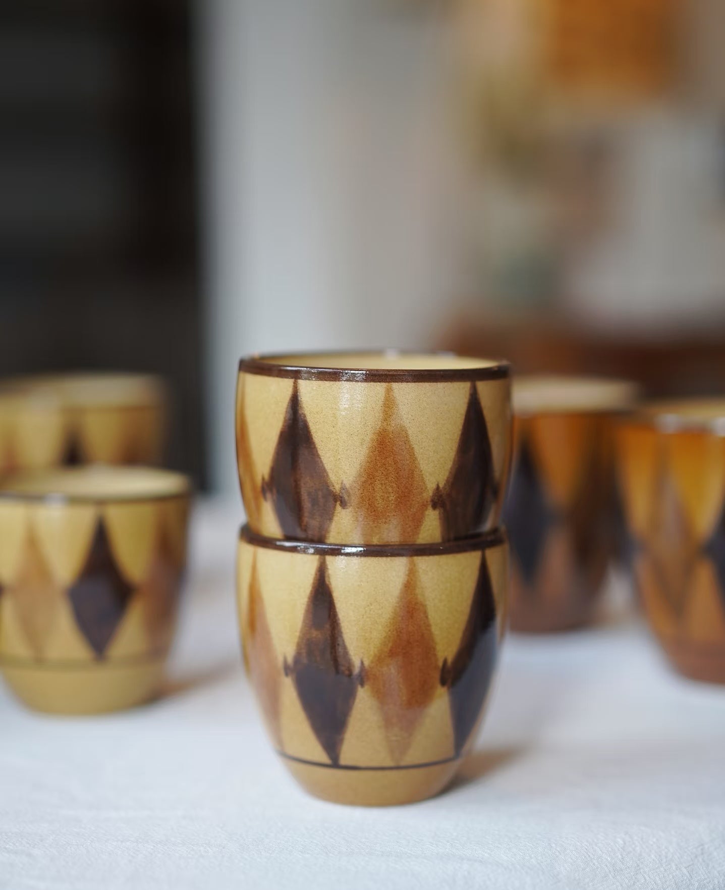 Kilnora Shisō diamond-shaped porcelain cup with geometric underglaze motifs
