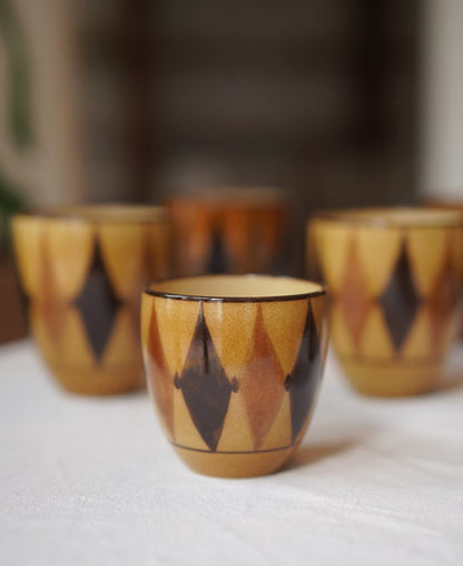 Kilnora Shisō diamond-shaped porcelain cup with geometric underglaze motifs