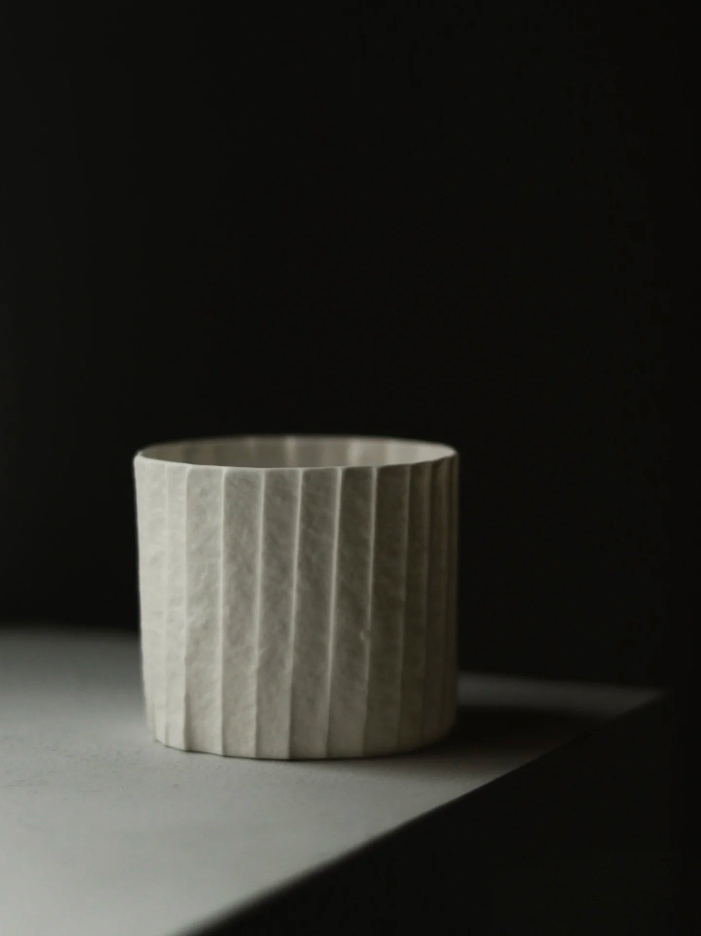 Kilnora Lumora Stonefold Series 180 ml porcelain cup featuring handcrafted rock-fold textures and soft translucence.