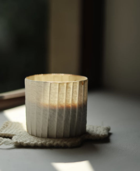 Kilnora Lumora Stonefold Series 250 ml porcelain cup with natural stone-folded facets and delicate light-capturing translucence.