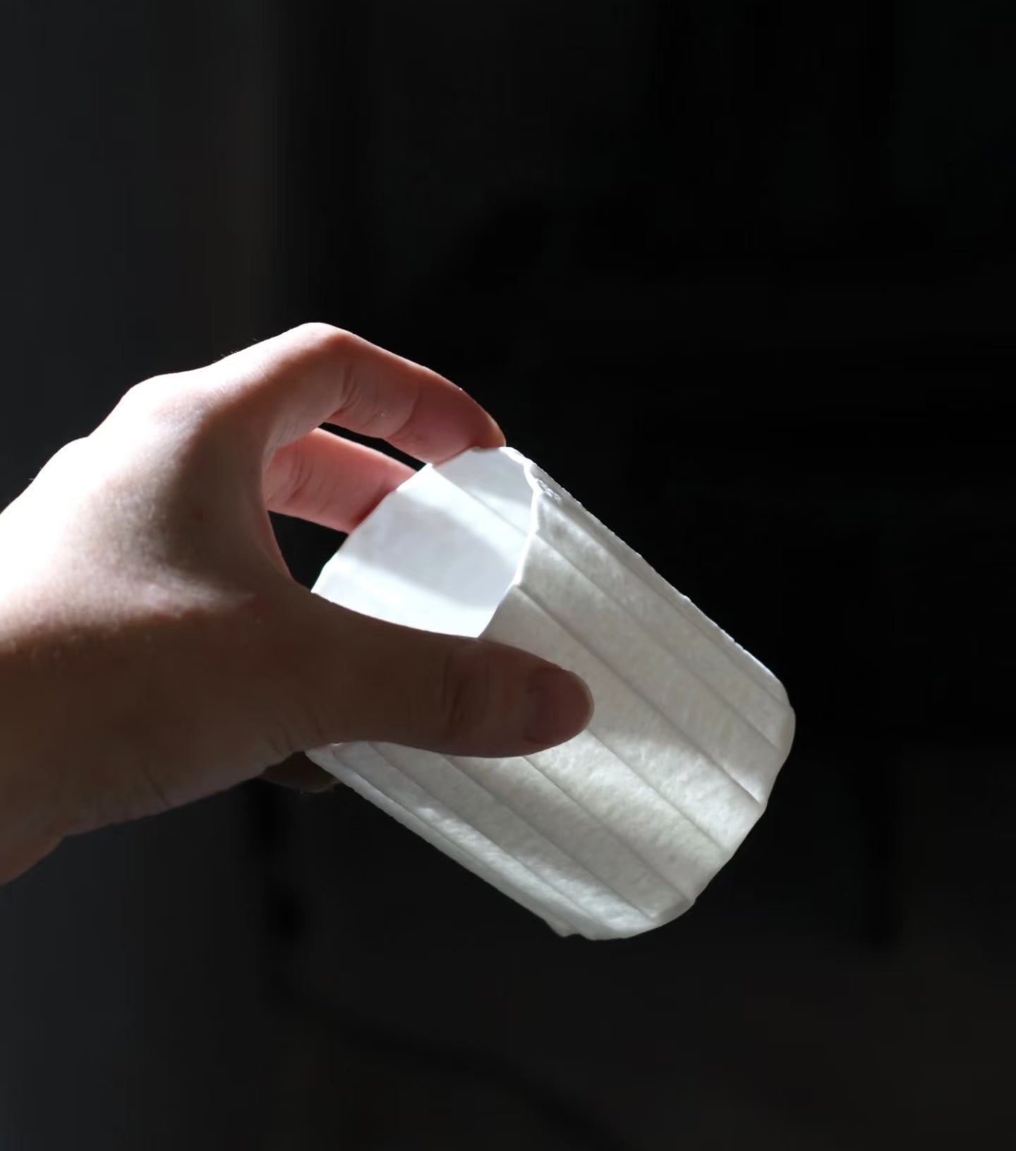 Kilnora Lumora Stonefold Series 250 ml porcelain cup with natural stone-folded facets and delicate light-capturing translucence.