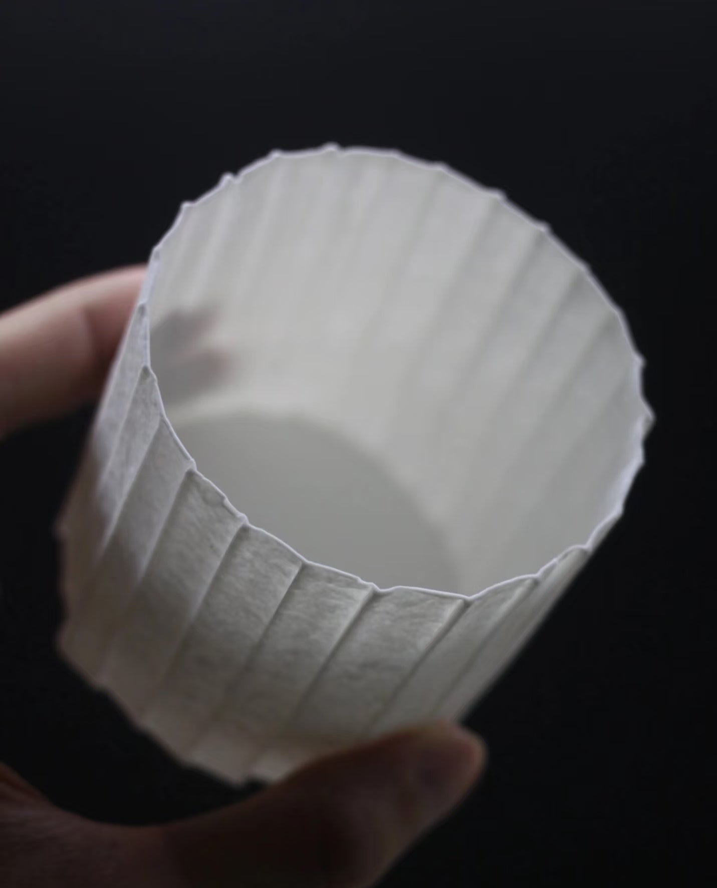 Kilnora Lumora Stonefold Series 250 ml porcelain cup with natural stone-folded facets and delicate light-capturing translucence.